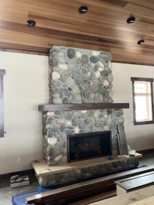 A large stone fireplace.