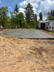 New residential concrete slab poured for a garage or building foundation by Trepanier Masonry in Bemidji, MN.