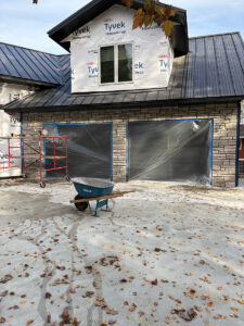 Custom stone veneer exterior installed on a residential garage by Trepanier Masonry in Bemidji, MN.