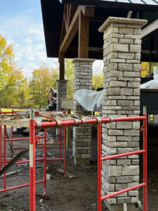 Custom natural stone masonry columns installed on a residential covered porch by Trepanier Masonry in Bemidji, MN.