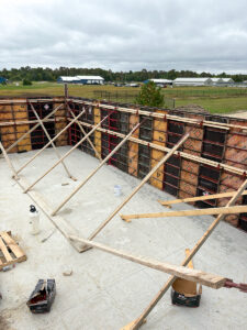Commercial concrete foundation wall forms and concrete slab under construction by Trepanier Masonry in Bemidji, MN.